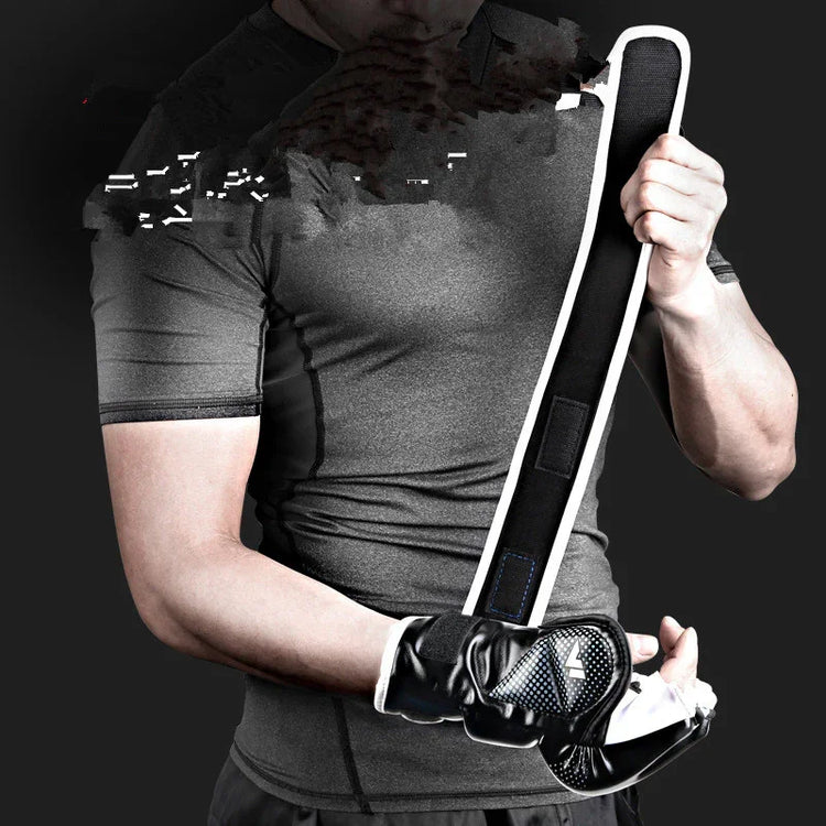 Man in fitted grey short sleeve athletic shirt with black training gloves holding padded strap