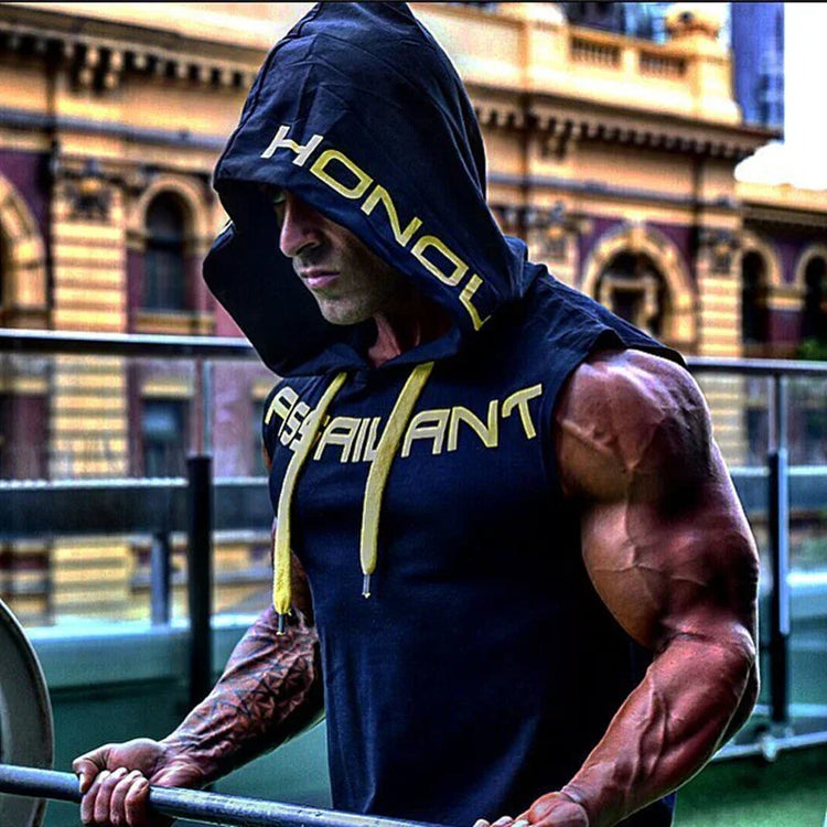 Man wearing sleeveless black hooded muscle shirt with bold yellow lettering, athletic fit