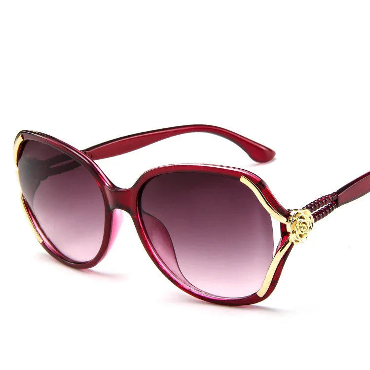 Oversized red sunglasses with gold accents and gradient lenses, feminine streetwear style