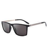 Black square-frame sunglasses with dark lenses and metallic temples, modern streetwear style