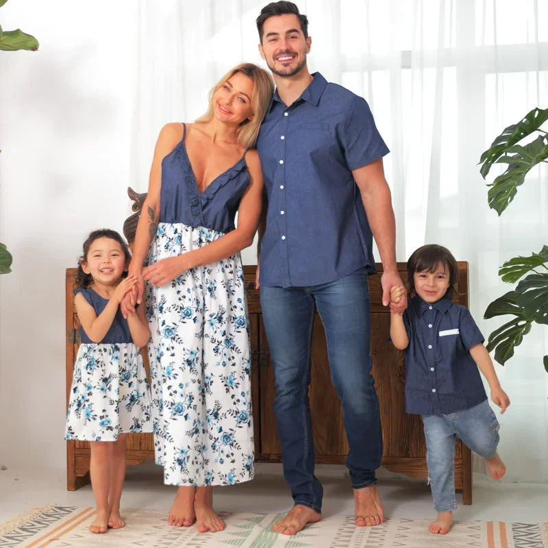 Family in matching blue and white outfits, women in floral dresses, men in denim shirts and jeans