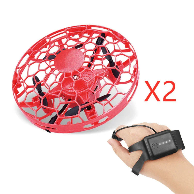 Red mini drone with protective cage and gesture control wristband, tech gadget