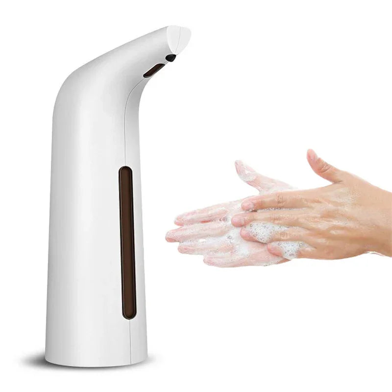Automatic white soap dispenser dispensing foam onto hands being washed