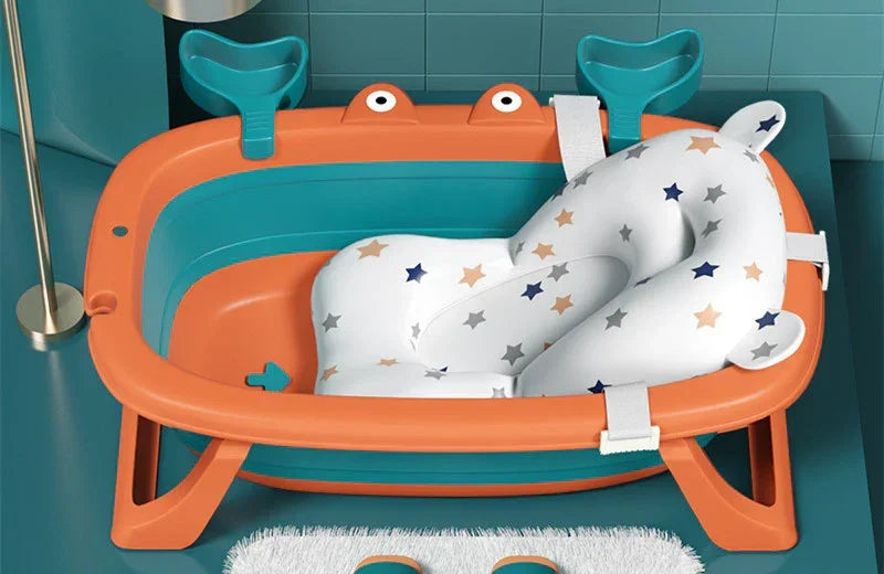 Orange and teal baby bathtub with star-patterned cushioned insert, modern design