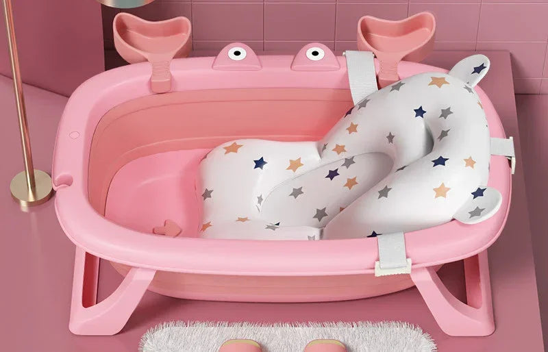Pink plastic baby bathtub with supportive star-patterned cushion and animal-shaped accents
