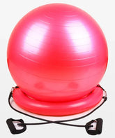 Pink exercise stability ball with resistance bands on white background