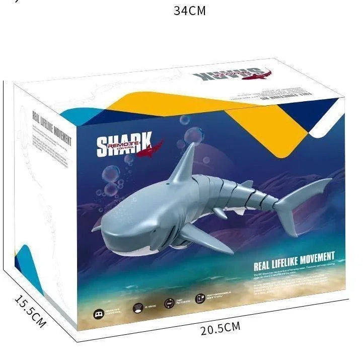 Box of a remote control shark toy with lifelike movement, featuring blue and gray color, product dimensions shown.