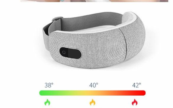 Light grey adjustable heated eye mask with soft fabric material and digital temperature display.