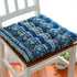 Blue bohemian patterned cotton chair cushion with plush, tufted texture and soft fit.