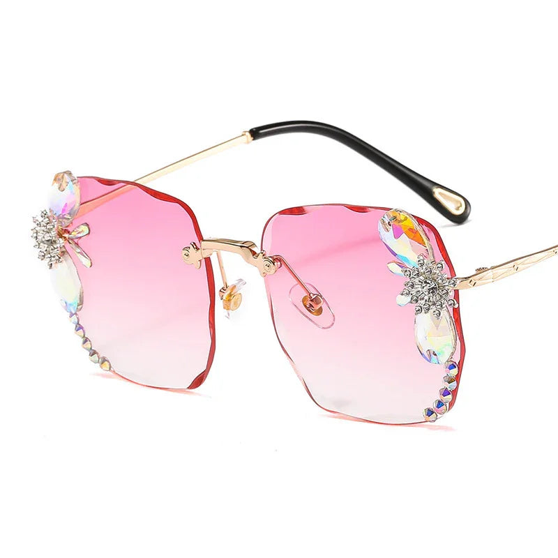 Square pink gradient sunglasses with gold frames and crystal dragonfly accents