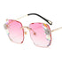 Square pink gradient sunglasses with gold frames and crystal dragonfly accents