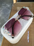 Oversized square sunglasses with purple gradient lenses and crystal floral embellishments