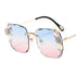 Gradient blue and pink rimless sunglasses with crystal flower accents and gold metal arms