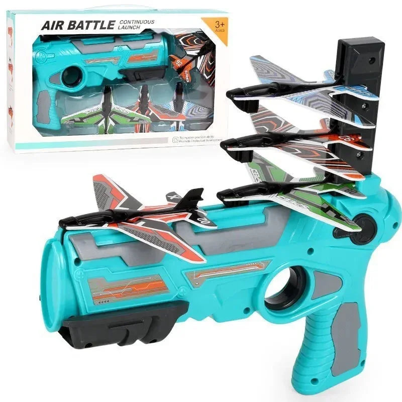 Futuristic turquoise and gray toy launcher with four colorful foam airplanes, ergonomic grip