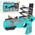 Futuristic turquoise and gray toy launcher with four colorful foam airplanes, ergonomic grip