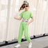 Girl wearing light green short sleeve jumpsuit with sporty elastic waistband and casual fit