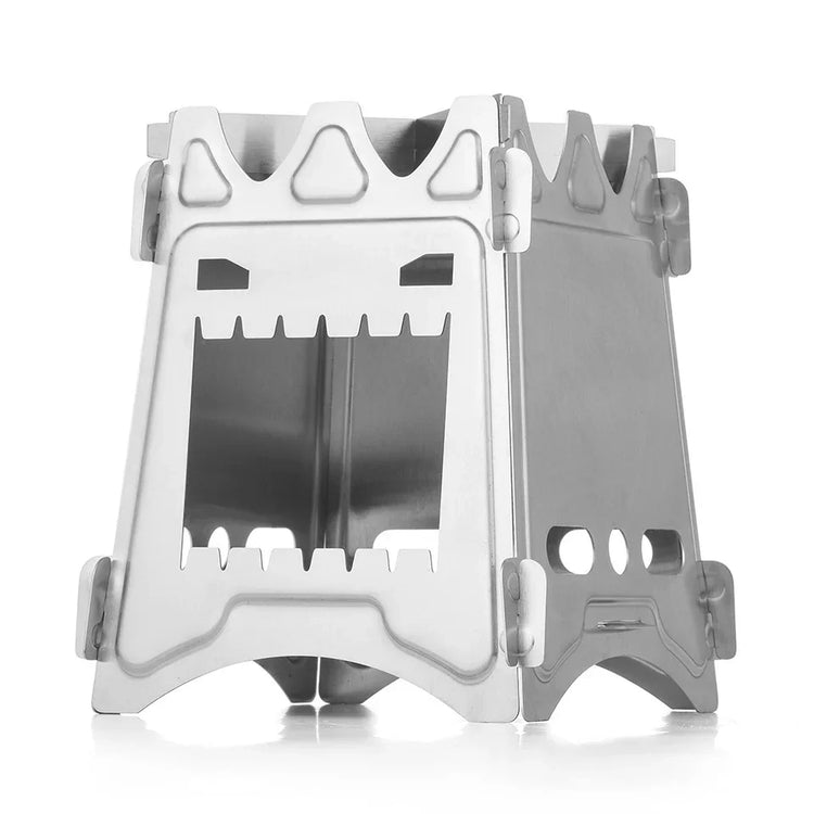 Silver metal foldable camping stove with cutout monster face design, compact and portable