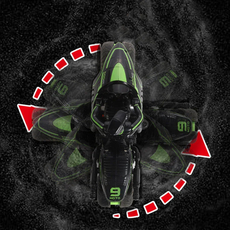 Black and green futuristic toy motorcycle spinning on textured dark surface, overhead view
