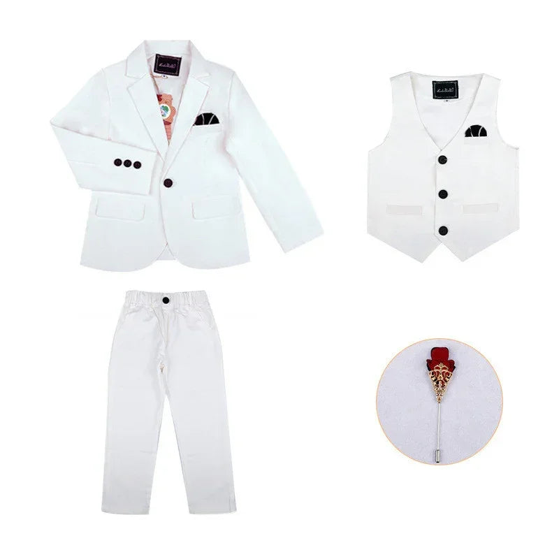 White kids formal suit set with blazer, vest, pants, and decorative lapel pin