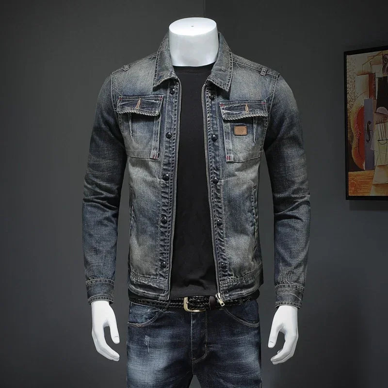 Fitted men's faded denim jacket with button closure, black shirt, and matching jeans.