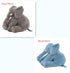Gray and blue plush elephant toys in seated position, soft fabric, two sizes shown