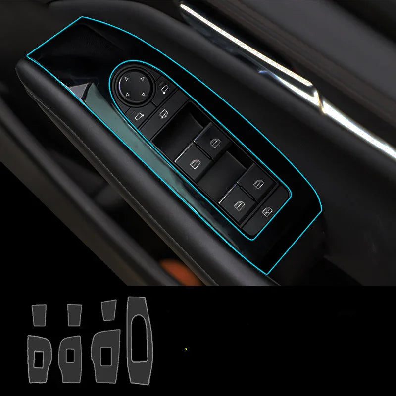 Black car door window switch panel with blue trim outlines, modern glossy finish