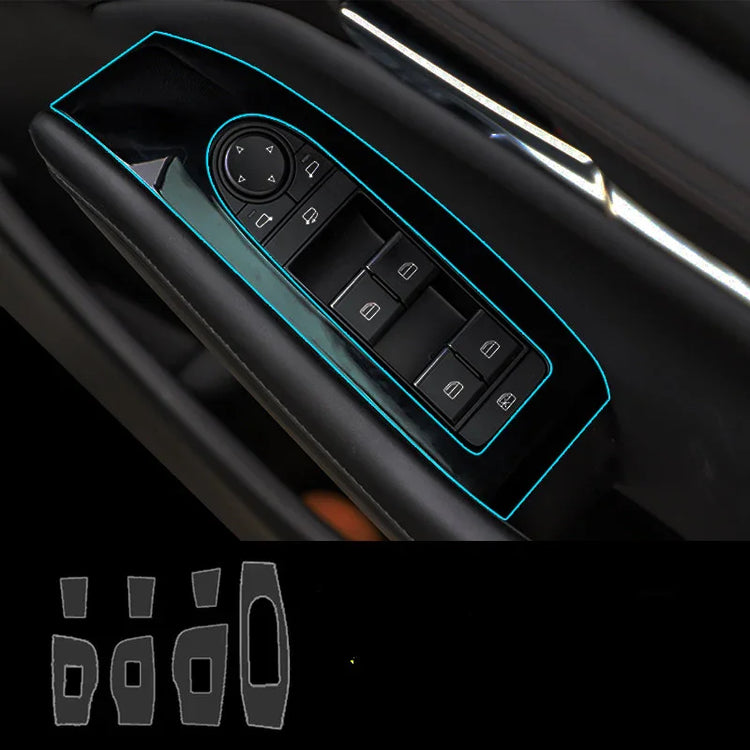 Black car door window switch panel with blue trim outlines, modern glossy finish