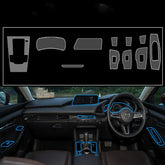 Black car interior dashboard and controls with blue-trim accessories, modern layout