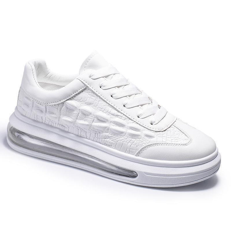 White sneaker with crocodile texture, thick sole, and visible air cushioning
