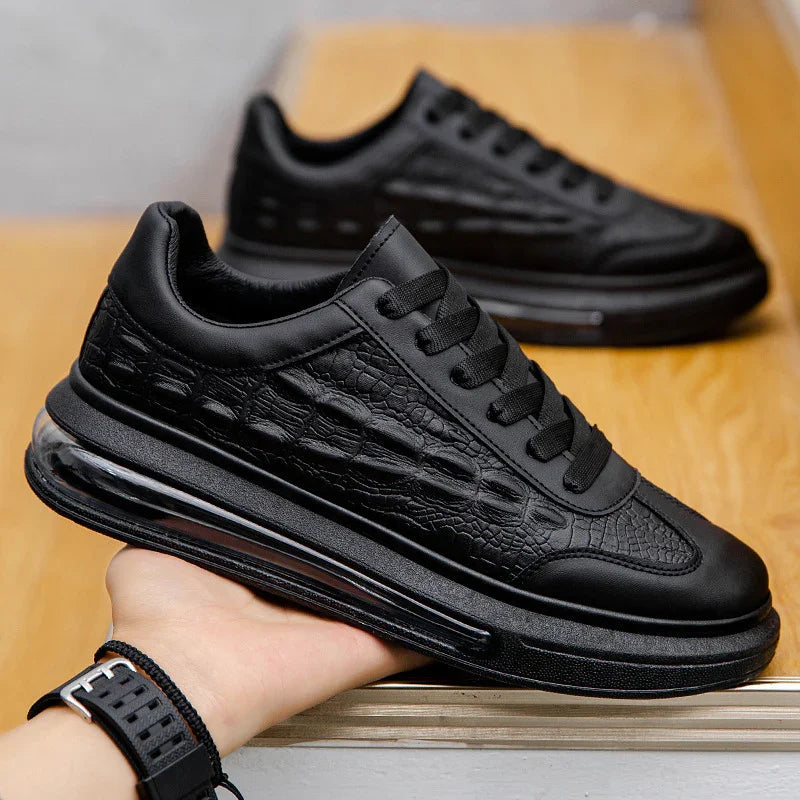 Black chunky sneaker with textured faux leather, thick sole, modern streetwear style