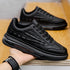 Black chunky sneaker with textured faux leather, thick sole, modern streetwear style