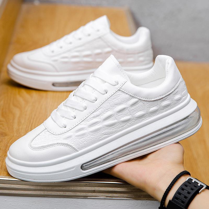 White textured low-top sneaker with clear sole and chunky fit, modern streetwear style