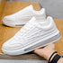 White textured low-top sneaker with clear sole and chunky fit, modern streetwear style