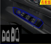 Black car door control panel for windows and mirrors with illuminated blue outline, plastic finish.
