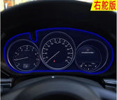 LED illuminated car dashboard cluster with speedometer and fuel gauge in a dark interior