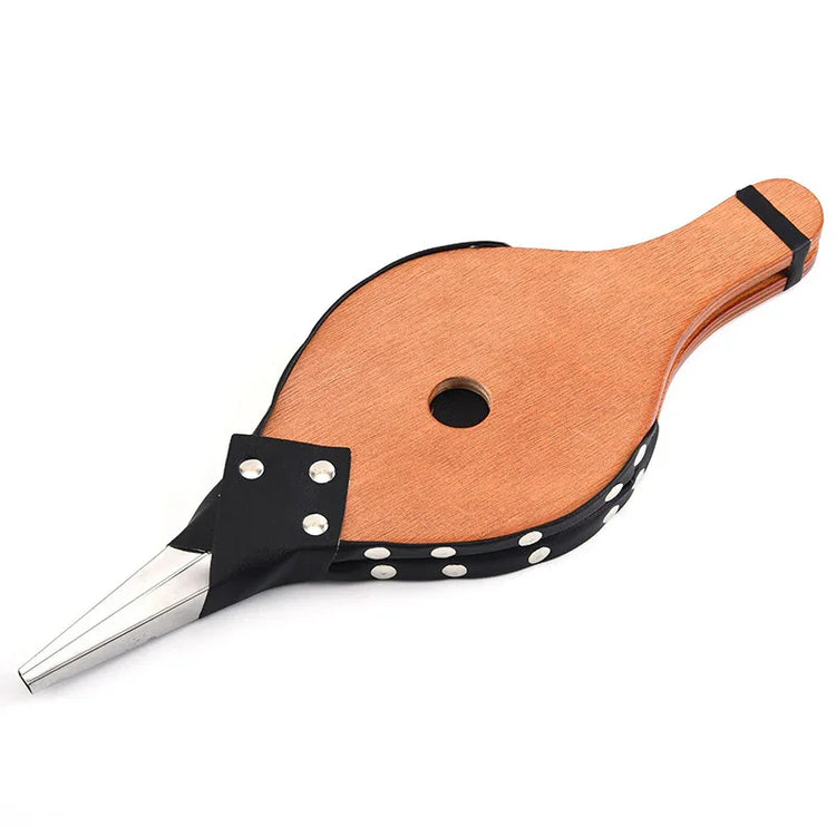 Handheld wooden and leather fireplace bellows with metal nozzle on white background