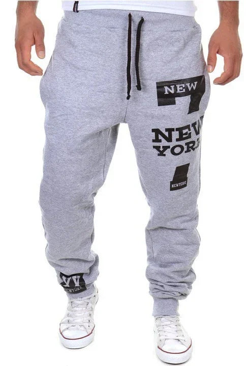 Men's grey jogger sweatpants with black New York text print, relaxed fit, drawstring waist
