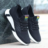 Black mesh knit sneakers with white soles, lightweight breathable athletic fit