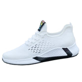 White mesh knit sneaker with black sole accents, lightweight athletic fit