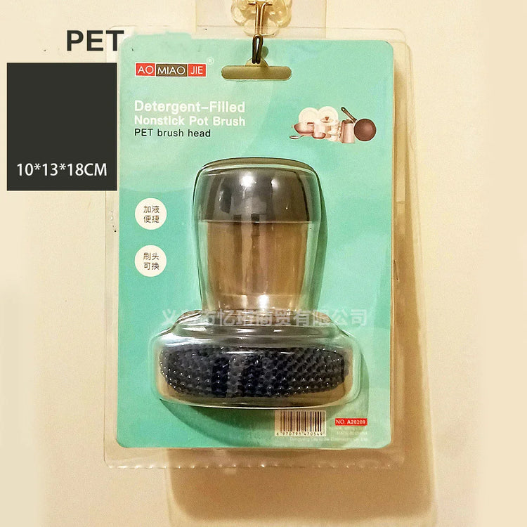 Detergent-filled nonstick pot brush with black bristles in clear packaging, metallic handle.