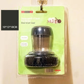 Detergent-filled steel pot brush with replaceable black brush head in clear packaging