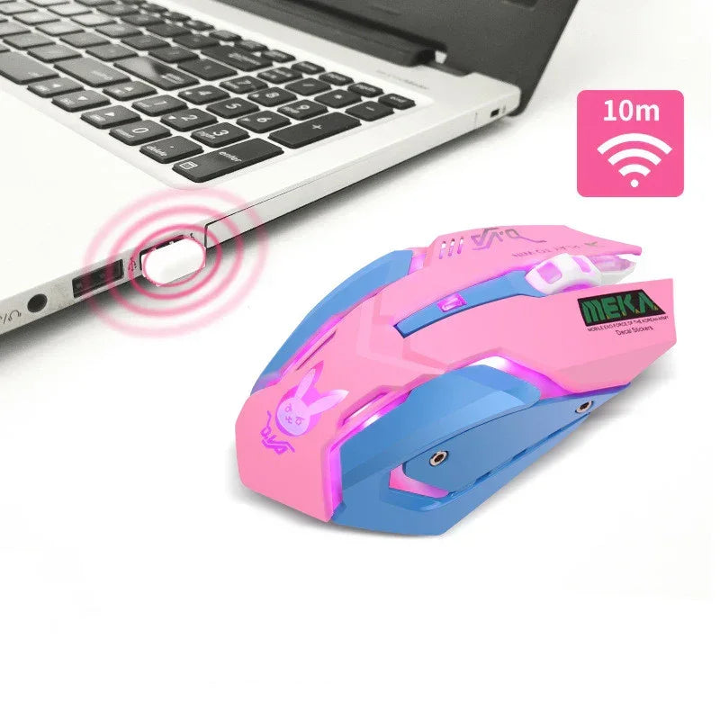 Pink and blue wireless gaming mouse with LED lights and ergonomic design next to a laptop.