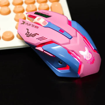 Futuristic pink and blue gaming mouse with angular design and LED lighting on black desk