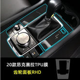 Black leather car gear shift with metallic control dial and glossy panel, TPU cover outlined in blue.