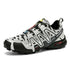 Men’s chunky streetwear sneaker in black, white, and gray with camo pattern and rugged sole