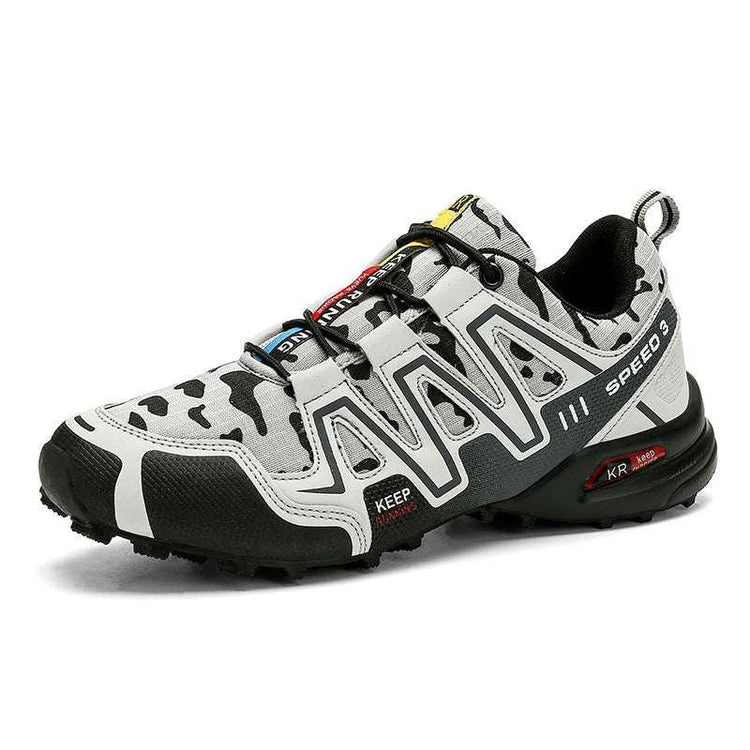 Men’s chunky streetwear sneaker in black, white, and gray with camo pattern and rugged sole