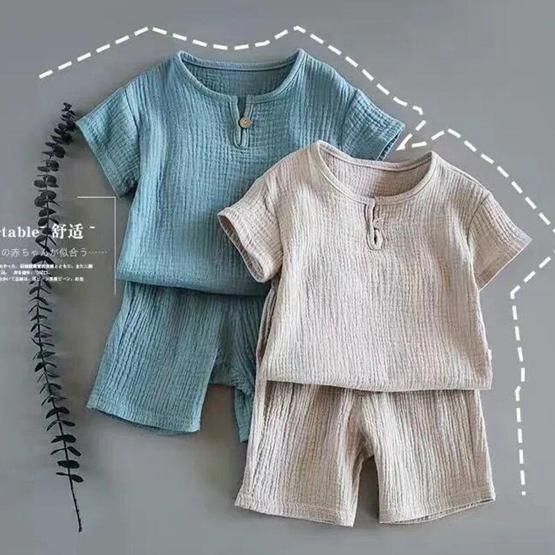Two short-sleeve cotton lounge sets in blue and beige with textured fabric and relaxed fit