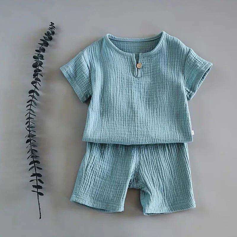 Light blue textured cotton two-piece set with short sleeves and shorts, relaxed fit