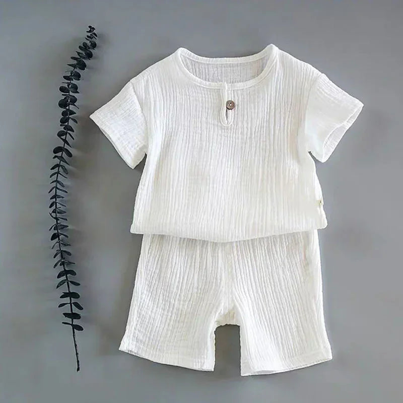 White cotton two-piece set with short sleeves and shorts, loose fit, textured fabric
