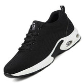 Black mesh athletic sneaker with white sole and air cushioning, lace-up, modern streetwear style.